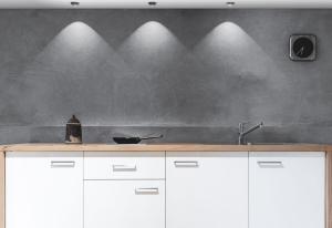 a kitchen with white cabinets and a stainless steel sink at Appartement E3 in Wasserburg am Inn