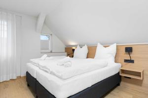 Postel nebo postele na pokoji v ubytování Hotel Garni Traube