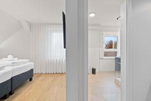 Postel nebo postele na pokoji v ubytování Hotel Garni Traube