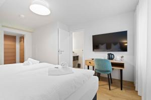 Postel nebo postele na pokoji v ubytování Hotel Garni Traube