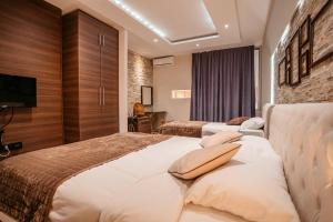 Katil atau katil-katil dalam bilik di MAGICO Rooms & Apartments
