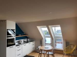 Kuchyň nebo kuchyňský kout v ubytování Appartement L'Embarcadère