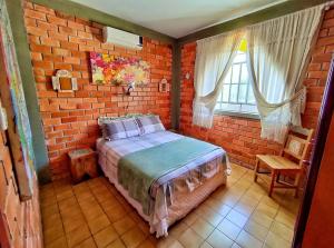 Tempat tidur dalam kamar di Casa Rústica