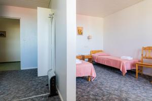 Postel nebo postele na pokoji v ubytování Staadioni Hotel
