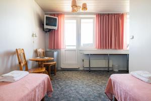 Postel nebo postele na pokoji v ubytování Staadioni Hotel