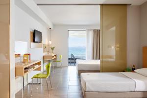 Posteľ alebo postele v izbe v ubytovaní Margarita Sea Side Hotel