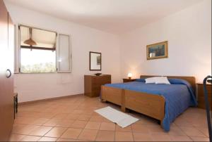 Krevet ili kreveti u jedinici u okviru objekta Villa Mimosa ad Alghero a 2km dalla spiaggia per 6 persone