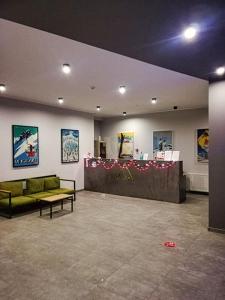 a living room with a green couch and a table at Gudauri Vista 6 in Gudauri