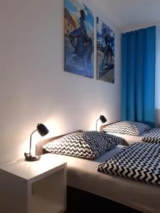 Ein Bett oder Betten in einem Zimmer der Unterkunft Apartament Bachusik