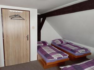 Postel nebo postele na pokoji v ubytování Pension Hraničář