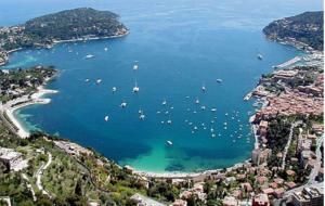an aerial view of a harbor with boats in the water at Villafranca in Villefranche-sur-Mer