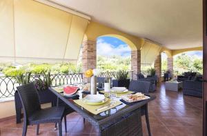 Posedenie v ubytovaní Alghero Villa Mistral per 7 persone Terrazza BBQ AC WiFi