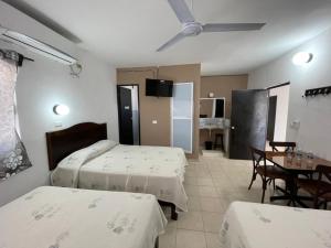 Postel nebo postele na pokoji v ubytování Hotel Moreno