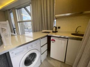 A kitchen or kitchenette at Le Luxe Suites Hotel & Spa