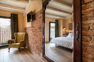 Ein Bett oder Betten in einem Zimmer der Unterkunft Priorat Aparthotel