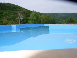 a swimming pool with a view of a mountain at COMPLEX HARMONY/КОМПЛЕКС ХАРМОНИЯ in Tryavna +18 photos