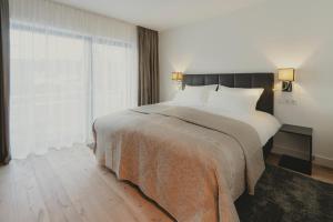 Postel nebo postele na pokoji v ubytování Bergkranz Apartments