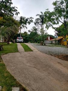 a car parked on the side of a road at Kitnet na Serra de São Pedro in São Pedro da Serra