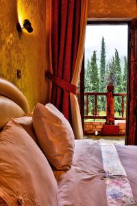 Postel nebo postele na pokoji v ubytování Hotel Polydrosos
