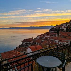 a view from a balcony of a town with the water at PS Apartments in Ohrid