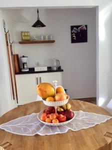 a bowl of fruit sitting on top of a table at Casa Lela II in Fuencaliente de la Palma