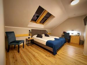 En eller flere senge i et værelse på Pensjonat i Restauracja Hubertówka