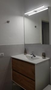 a bathroom with a sink and a mirror at Casa Lela II in Fuencaliente de la Palma