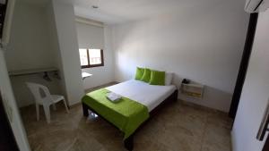 A bed or beds in a room at Perla De La Sabana