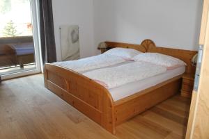 En eller flere senge i et værelse på Ferienhaus Gschwandtl