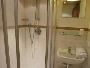a bathroom with a shower and a sink at Ferienwohnungen Marchanger in Niederau