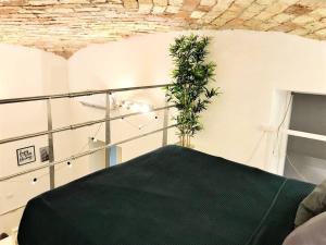 Posteľ alebo postele v izbe v ubytovaní Beautifully Renovated Loft in Trastevere