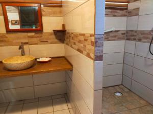 a bathroom with a sink and a shower at Chez Faby in Saül