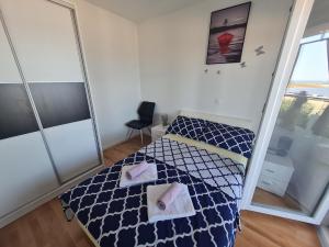 Postel nebo postele na pokoji v ubytování Apartmani Ždrijac Nin