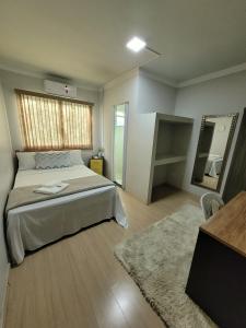 Postel nebo postele na pokoji v ubytování Hotel Hiperion Maringá