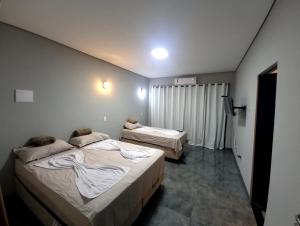 Postel nebo postele na pokoji v ubytování Fervedouro e pousada Por Enquanto