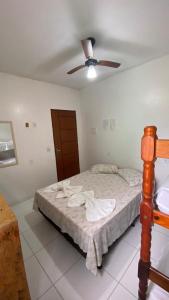 Tempat tidur dalam kamar di Pousada Manancial