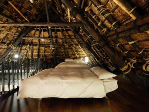 a bedroom with a bed in an attic at 芹生庵 in Kyoto