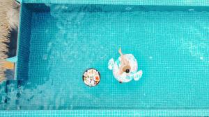 Der Swimmingpool an oder in der Nähe von Mimosa Resort & Spa
