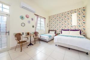 Cama ou camas em um quarto em Ying Hsuan House