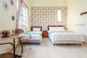 Cama ou camas em um quarto em Ying Hsuan House