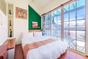 Cama ou camas em um quarto em Ying Hsuan House