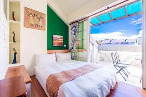 Cama ou camas em um quarto em Ying Hsuan House
