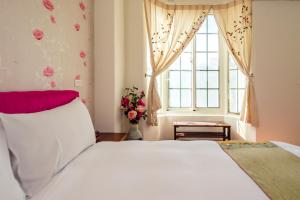 Cama ou camas em um quarto em Ying Hsuan House