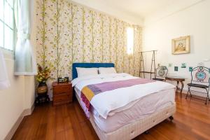 Cama ou camas em um quarto em Ying Hsuan House