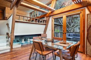a dining room with a table and chairs at Cambria Treehouse in Cambria