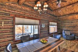 a dining room with a wooden table and chairs at Downtown Buena Vista Cabin with Patio and Grill! in Buena Vista