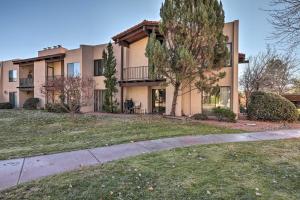 an apartment building with a sidewalk in front of it at Condo with Mtn Views, Balcony and Hot Tub Access! in Sedona