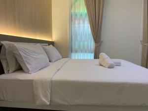 Cama o camas de una habitación en Baansuanprannok Hotel