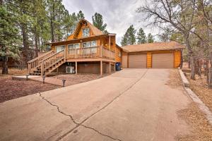 a large wooden house with a porch and a driveway at Show Low Cabin with BBQ and Fire Pit Pets Welcome! in Show Low