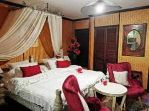 Krevet ili kreveti u jedinici u okviru objekta Hôtel Fenua Mata'i'oa